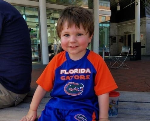 Jonathan in his Florida orange and blue smiling at the camera